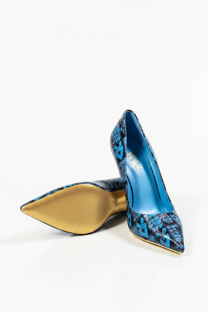 Fola Pump Heels - One shoe upright showing blue African print, other shoe on its side revealing gold sole with Yelé logo