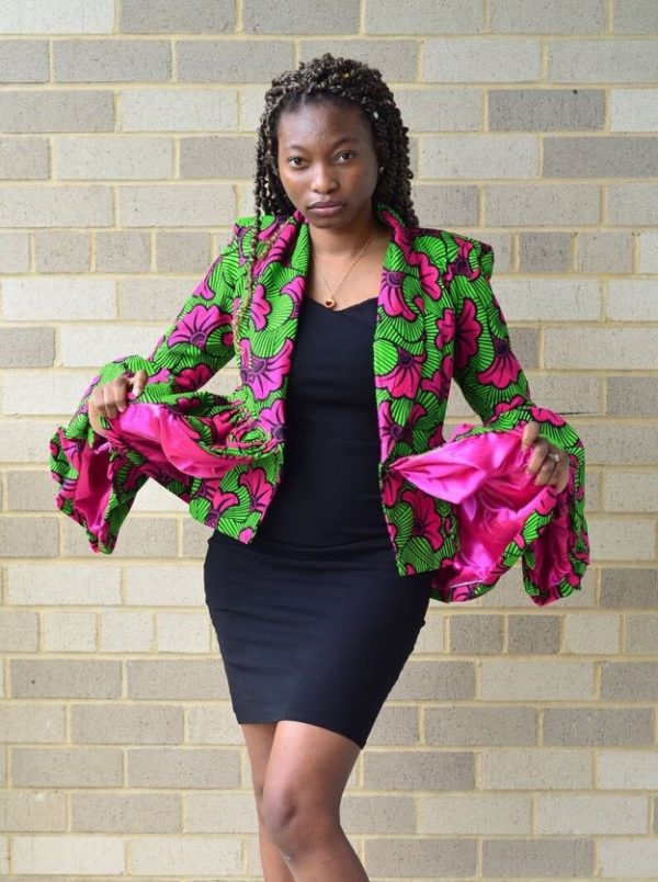 Model is wearing a jacket made from an Ankara with a satin fabric mix.