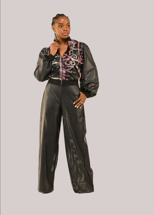Model in Yele's Open-Back Sequin Bomber Jacket and Vegan Leather Pants with Adire cultural prints