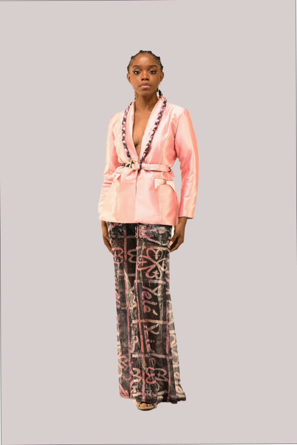 Model in Yele's Adire Sequin Pant Suit with Power of Love print and God's protection symbol, featuring braided sequin detail and sheer wide-leg pants