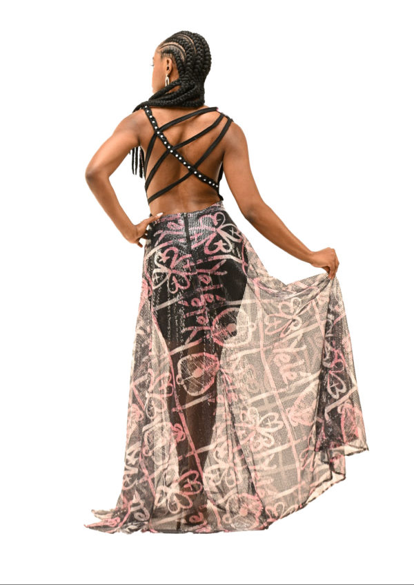 Full-length shot of an open-back dress with cowl neck and braids, combining African heritage and modern fashion for a show-stopping appearance