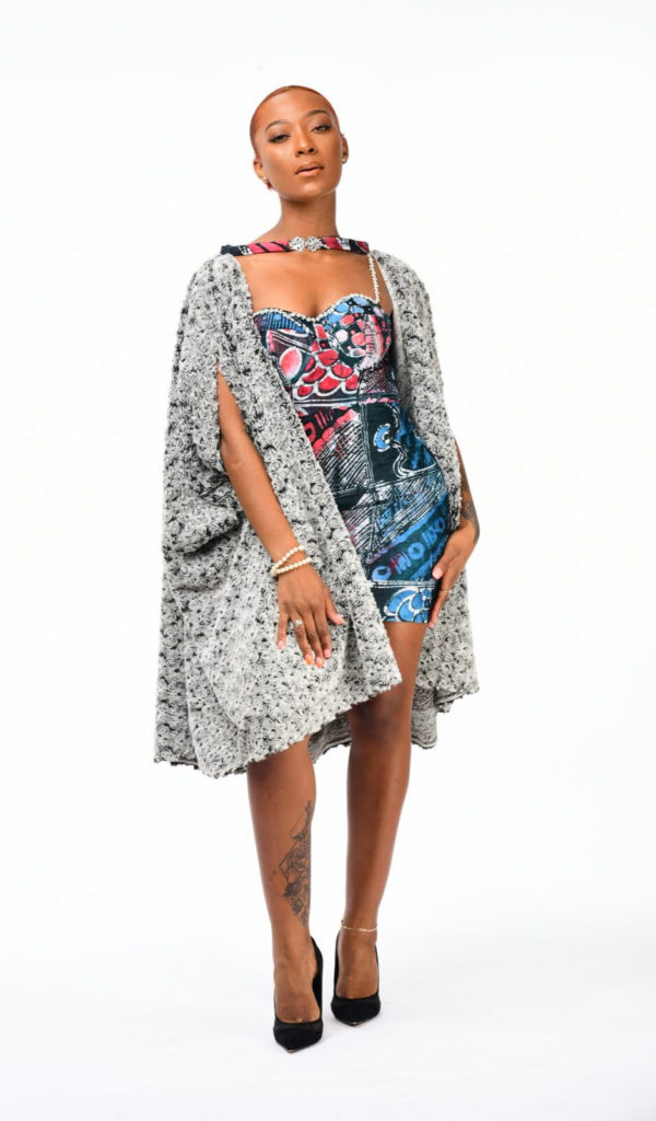 Model wearing Adire dress with cape